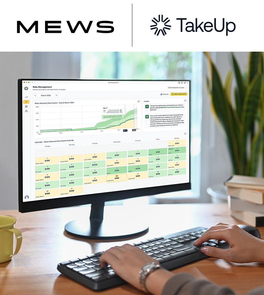 Woman looking at TakeUp dashboard on desktop computer