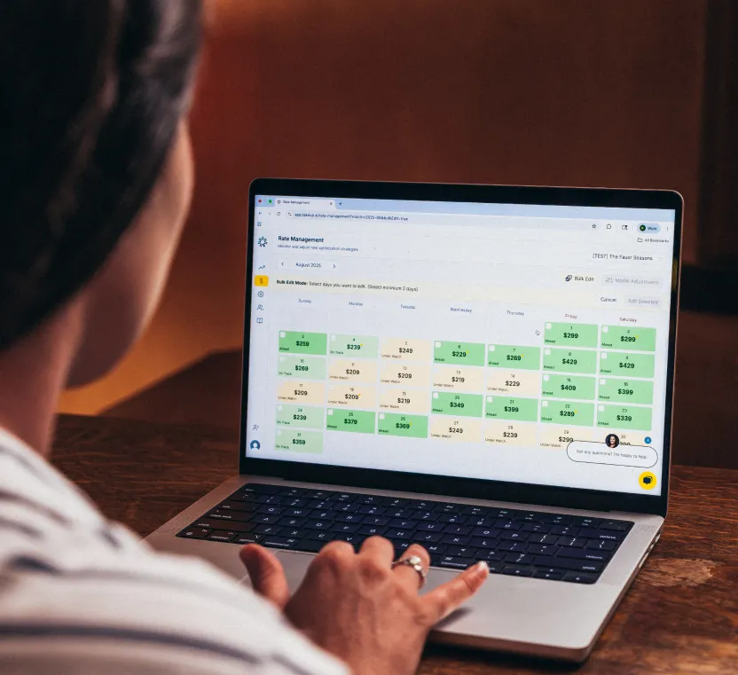 woman working on laptop looking at TakeUp rate management page